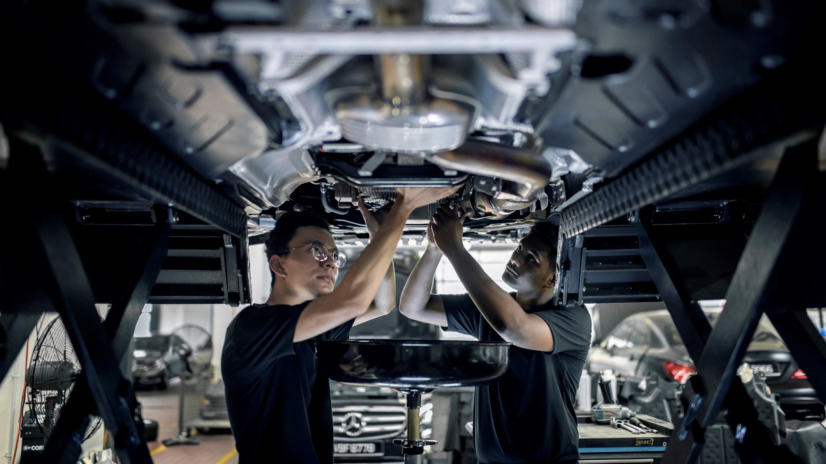 Advanced Modern Apprenticeship Two Mercedes-Benz Apprentices working on a vehicle